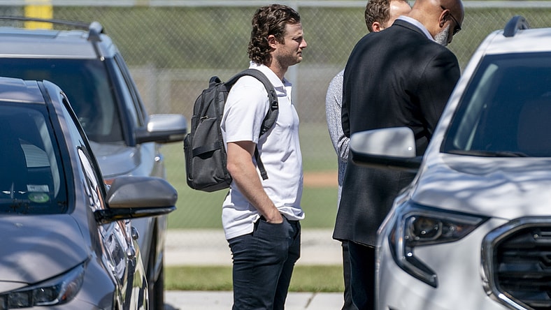 Feb 23, 2022; Jupiter, FL, USA;  New York Yankees pitcher Gerrit Cole, center, arrives for MLB contract negotiations at Roger Dean Stadium in Jupiter, Florida on February 23, 2022.   Mandatory Credit: Greg Lovett-USA TODAY NETWORK