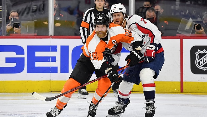 Feb 17, 2022; Philadelphia, Pennsylvania, USA; Philadelphia Flyers center Claude Giroux (28) and Washington Capitals defenseman Nick Jensen (3) at Wells Fargo Center. Mandatory Credit: Eric Hartline-USA TODAY Sports