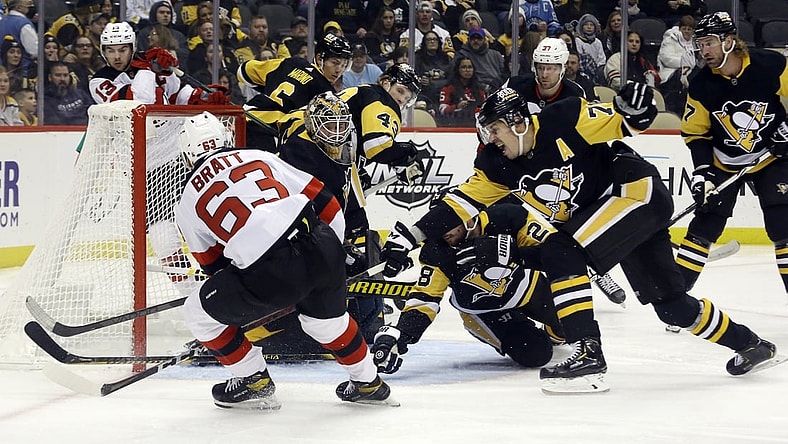 Feb 24, 2022; Pittsburgh, Pennsylvania, USA;  New Jersey Devils left wing Jesper Bratt (63) scores a goal against the Pittsburgh Penguins during the first period at PPG Paints Arena. Mandatory Credit: Charles LeClaire-USA TODAY Sports