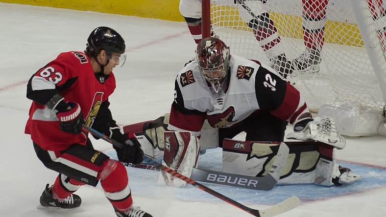 Feb 13, 2020; Ottawa, Ontario, CAN; Ottawa Senators right wing Tyler Ennis (63) shoots on Arizona Coyotes goalie Antti Raanta (32) in the third period at the Canadian Tire Centre. Mandatory Credit: Marc DesRosiers-USA TODAY Sports