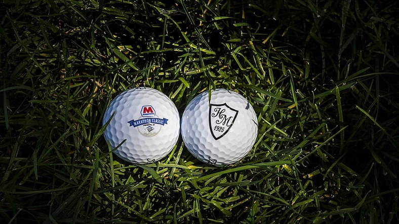 Aug 9, 2020; Sylvania, OH, USA;  Marathon Classic and Highland Meadow Logo Golf balls during the final round of the Marathon LPGA Classic golf tournament at Highlands Meadows Golf Club. Mandatory Credit: Marc Lebryk-USA TODAY Sports