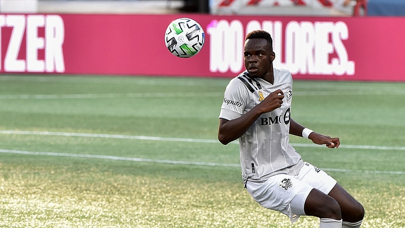 Sep 23, 2020; Foxborough, Massachusetts, USA;  Montreal Impact defender Karifa Yao (24) keeps his eyes on the ball during the first half against the New England Revolution at Gillette Stadium. Mandatory Credit: Bob DeChiara-USA TODAY Sports