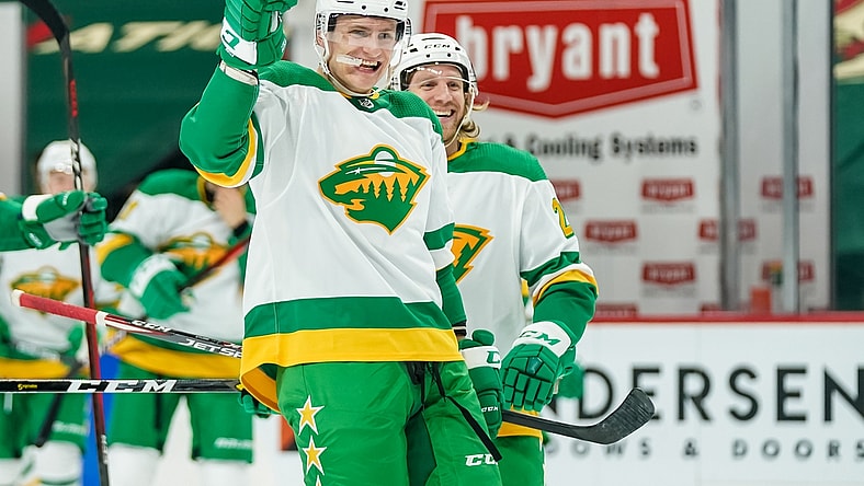 Jan 31, 2021; Saint Paul, Minnesota, USA; Minnesota Wild forward Nico Sturm (7) celebrates after an overtime goal by defenseman Jonas Brodin (not pictured) against the Colorado Avalanche at Xcel Energy Center. Mandatory Credit: Brace Hemmelgarn-USA TODAY Sports