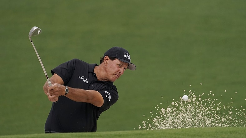 Apr 9, 2021; Augusta, Georgia, USA; Phil Mickelson hits out of a bunker on the 2nd hole during the second round of The Masters golf tournament. Mandatory Credit: Rob Schumacher-USA TODAY Sports
