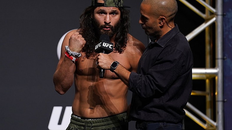 Apr 23, 2021; Jacksonville, Florida, USA; Jorge Masvidal (L) talks with UFC play-by-play commentator Jon Anik (R) during weigh-ins for UFC 261 at VyStar Veterans Memorial Arena. Mandatory Credit: Jasen Vinlove-USA TODAY Sports
