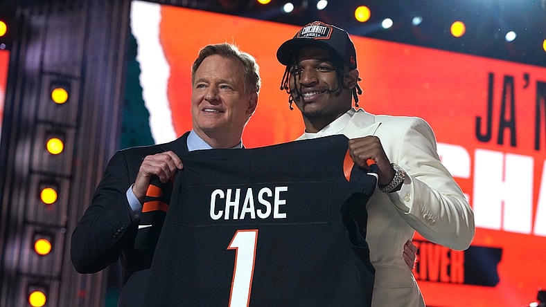 Apr 29, 2021; Cleveland, Ohio, USA; LSU Tigers wide receiver Ja'Marr Chase poses with NFL commissioner Roger Goodell after being selected as the fifth pick by the Cincinnati Bengals during the 2021 NFL Draft  at First Energy Stadium. Mandatory Credit: Kirby Lee-USA TODAY Sports