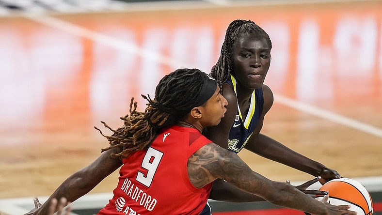 May 27, 2021; College Park, Georgia, USA; Dallas Wings center Awak Kuier (28) has the ball taken away by Atlanta Dream forward Crystal Bradford (9) during the second half at Gateway Center Arena at College Park. Mandatory Credit: Dale Zanine-USA TODAY Sports