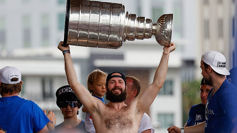 Jul 12, 2021; Tampa, FL, USA;  Tampa Bay Lightning right wing Nikita Kucherov (86) hoists the Stanley Cup during the Stanley Cup Championship parade. Mandatory Credit: Nathan Ray Seebeck-USA TODAY Sports