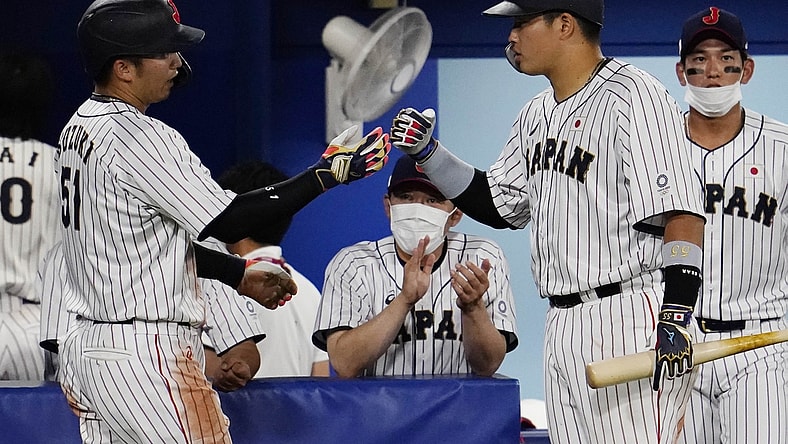 Aug 2, 2021; Yokohama, Japan; Team Japan outfielder Seiya Suzuki (51) celebrates after scoring a run against USA in a second round baseball game during the Tokyo 2020 Olympic Summer Games at Yokohama Baseball Stadium. Mandatory Credit: Mandi Wright-USA TODAY Sports