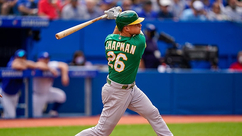 Sep 4, 2021; Toronto, Ontario, CAN; Oakland Athletics third baseman Matt Chapman (26) hits a home run against the Toronto Blue Jays during the fifth inning at Rogers Centre. Mandatory Credit: Kevin Sousa-USA TODAY Sports