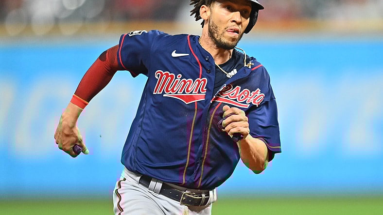 Sep 7, 2021; Cleveland, Ohio, USA; Minnesota Twins shortstop Andrelton Simmons (9) rounds third base to score during the ninth inning against the Cleveland Indians at Progressive Field. Mandatory Credit: Ken Blaze-USA TODAY Sports