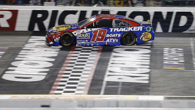 Sep 11, 2021; Richmond, Virginia, USA; NASCAR Cup Series driver Martin Truex Jr. (19) cross the finish line to win the Federated Auto Parts 400 Salute to First Responders at Richmond International Raceway. Mandatory Credit: Amber Searls-USA TODAY Sports