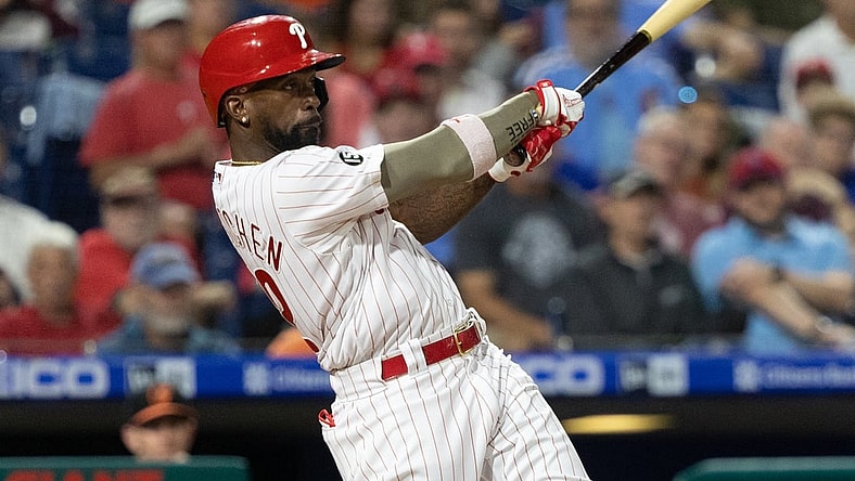 Sep 21, 2021; Philadelphia, Pennsylvania, USA; Philadelphia Phillies center fielder Andrew McCutchen (22) hits a single against the Baltimore Orioles during the fourth inning at Citizens Bank Park. Mandatory Credit: Bill Streicher-USA TODAY Sports