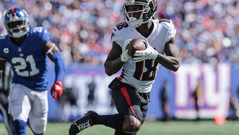 Sep 26, 2021; East Rutherford, New Jersey, USA; Atlanta Falcons wide receiver Calvin Ridley (18) carries the ball past New York Giants free safety Jabrill Peppers (21) during the first quarter at MetLife Stadium. Mandatory Credit: Vincent Carchietta-USA TODAY Sports