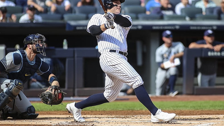 Oct 2, 2021; Bronx, New York, USA;  New York Yankees first baseman Anthony Rizzo (48) hits a solo home run in the first inning against the Tampa Bay Rays at Yankee Stadium. Mandatory Credit: Wendell Cruz-USA TODAY Sports