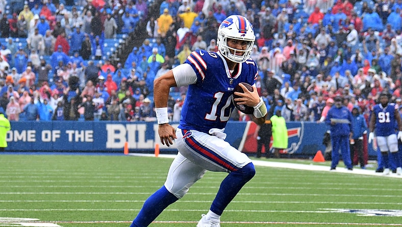 Oct 3, 2021; Orchard Park, New York, USA; Buffalo Bills quarterback Mitchell Trubisky (10) runs for a touchdown in the fourth quarter against the Houston Texans at Highmark Stadium. Mandatory Credit: Mark Konezny-USA TODAY Sports