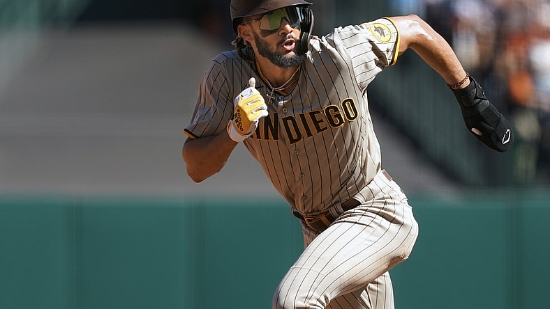 Oct 2, 2021; San Francisco, California, USA; San Diego Padres shortstop Fernando Tatis Jr. (23) runs to third base during the fourth inning against the San Francisco Giants at Oracle Park. Mandatory Credit: Darren Yamashita-USA TODAY Sports
