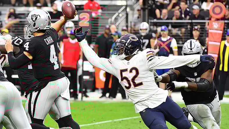 Oct 10, 2021; Paradise, Nevada, USA;  Chicago Bears outside linebacker Khalil Mack (52) pressures Las Vegas Raiders quarterback Derek Carr (4) during a game at Allegiant Stadium. Mandatory Credit: Stephen R. Sylvanie-USA TODAY Sports