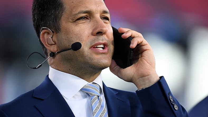 Oct 18, 2021; Nashville, Tennessee, USA; ESPN NFL Insider Adam Schefter talks on his phone before the Monday Night Football game between the Tennessee Titans and the Buffalo Bills at Nissan Stadium. Mandatory Credit: Christopher Hanewinckel-USA TODAY Sports