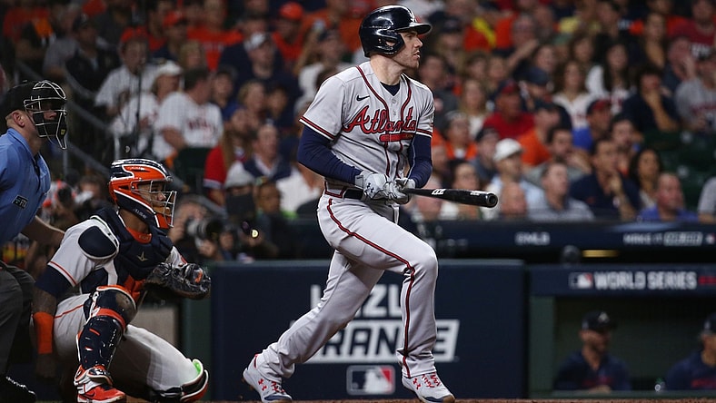 Nov 2, 2021; Houston, TX, USA; Atlanta Braves first baseman Freddie Freeman (5) hits a solo home run against the Houston Astros during the seventh inning in game six of the 2021 World Series at Minute Maid Park. Mandatory Credit: Troy Taormina-USA TODAY Sports
