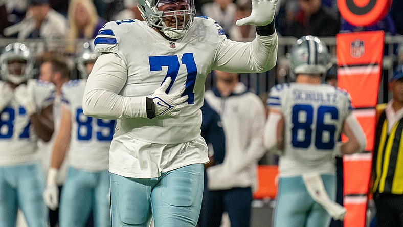 Oct 31, 2021; Minneapolis, Minnesota, USA; Dallas Cowboys offensive tackle La'el Collins (71) indicates he is an eligible receiver entering the game in the third quarter against the Minnesota Vikings at U.S. Bank Stadium. Mandatory Credit: Matt Blewett-USA TODAY Sports