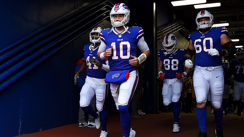 Nov 21, 2021; Orchard Park, New York, USA; Buffalo Bills quarterback Mitchell Trubisky (10) leads teammates to the field prior to the game against the Indianapolis Colts at Highmark Stadium. Mandatory Credit: Rich Barnes-USA TODAY Sports