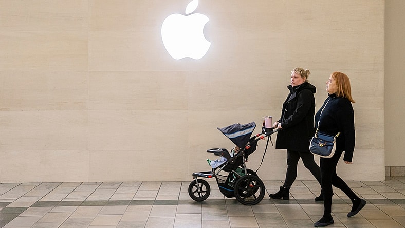 Two women walk under the Apple logo while shopping at Oxmoor Mall in Louisville, Kentucky on Black Friday. Nov 26, 2021

Aj4t9207