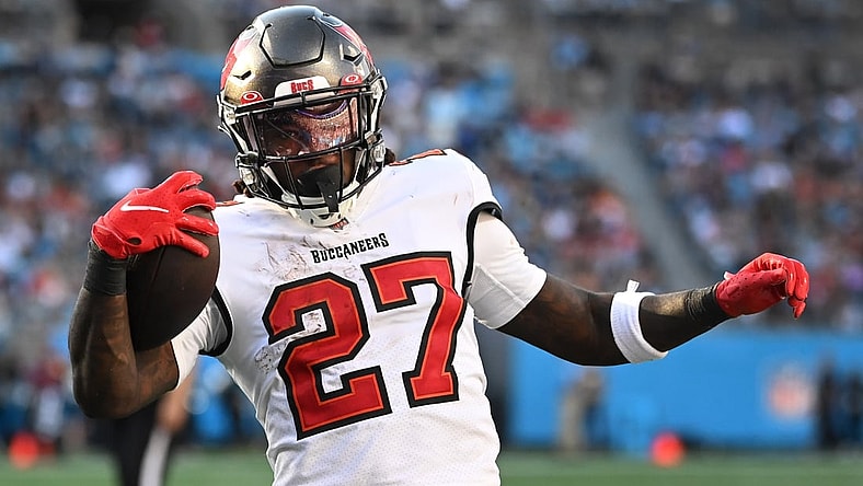 Dec 26, 2021; Charlotte, North Carolina, USA;  Tampa Bay Buccaneers running back Ronald Jones (27) scores a touchdown in the third quarter at Bank of America Stadium. Mandatory Credit: Bob Donnan-USA TODAY Sports