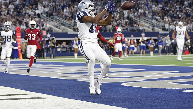 Jan 2, 2022; Arlington, Texas, USA; Dallas Cowboys wide receiver Amari Cooper (19) catches a touchdown pass in the fourth quarter against the Arizona Cardinals at AT&T Stadium. Mandatory Credit: Tim Heitman-USA TODAY Sports