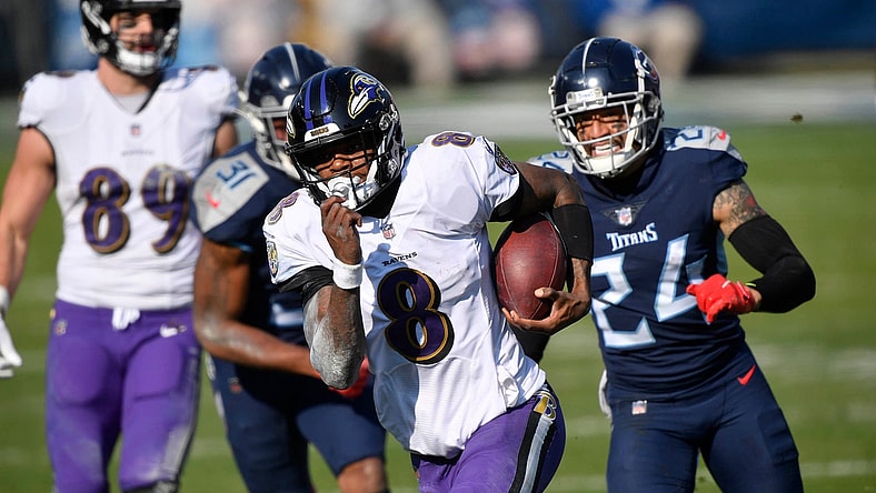 Baltimore Ravens quarterback Lamar Jackson (8) runs for a touchdown during their 20-13 victory over the Tennessee Titans in the AFC Wild Card game at Nissan Stadium in Nashville Jan. 10, 2021.
Titans Ravens 111