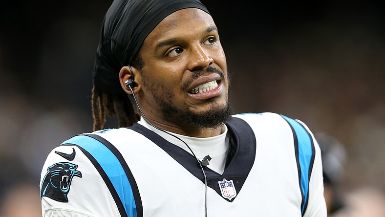Jan 2, 2022; New Orleans, Louisiana, USA; Carolina Panthers quarterback Cam Newton (1) on the sidelines in the second quarter against the New Orleans Saints at the Caesars Superdome. Mandatory Credit: Chuck Cook-USA TODAY Sports