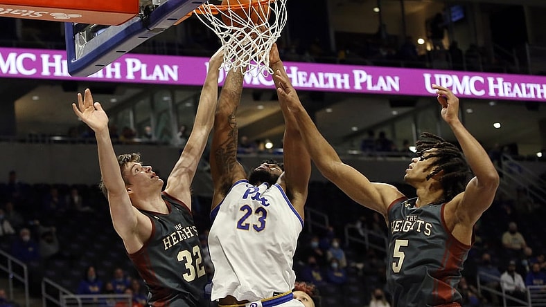 Jan 8, 2022; Pittsburgh, Pennsylvania, USA;  Pittsburgh Panthers forward John Hugley (23) shoots as Boston College Eagles center Justin Vander Baan (32) and guard DeMarr Langford Jr. (5) defend during the second half at the Petersen Events Center. The Panthers won 69-67. Mandatory Credit: Charles LeClaire-USA TODAY Sports