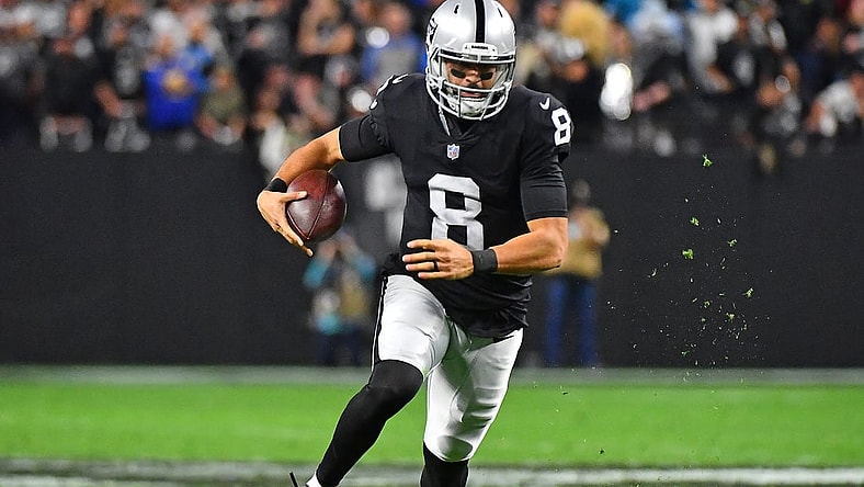 Jan 9, 2022; Paradise, Nevada, USA; Las Vegas Raiders quarterback Marcus Mariota (8) rushes with the ball during the fourth quarter against the Los Angeles Chargers at Allegiant Stadium. Mandatory Credit: Stephen R. Sylvanie-USA TODAY Sports