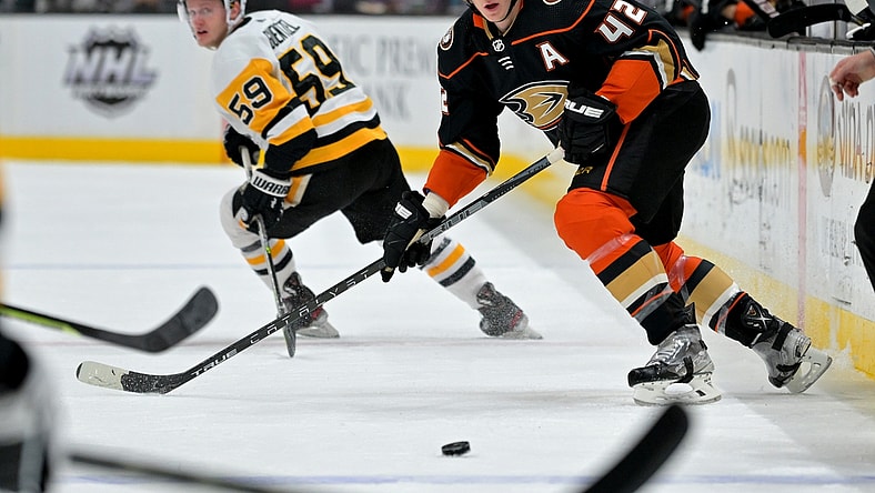 Jan 11, 2022; Anaheim, California, USA; Anaheim Ducks defenseman Josh Manson (42) passes the puck in the first half of the game against the Pittsburgh Penguins at Honda Center. Mandatory Credit: Jayne Kamin-Oncea-USA TODAY Sports