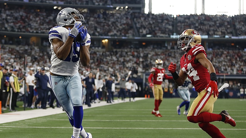 Jan 16, 2022; Arlington, Texas, USA; Dallas Cowboys wide receiver Amari Cooper (19) catches a touchdown pass in the second quarter against San Francisco 49ers defensive back K'Waun Williams (24) in a NFC Wild Card playoff football game at AT&T Stadium. Mandatory Credit: Tim Heitman-USA TODAY Sports