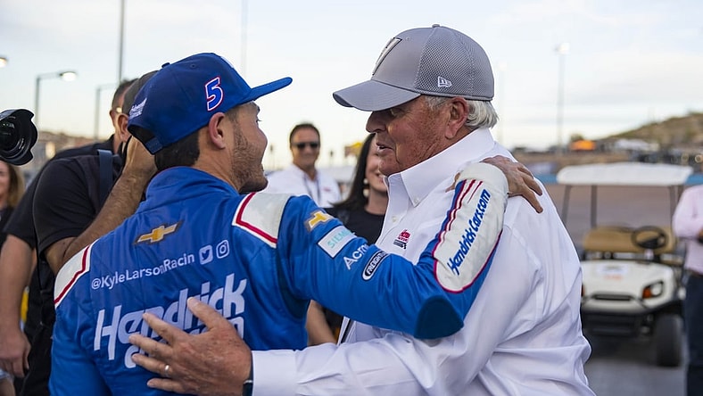 Nov 7, 2021; Avondale, Arizona, USA; NASCAR Cup Series driver Kyle Larson (left) celebrates with team owner Rick Hendrick after winning the NASCAR Cup Series Championship at Phoenix Raceway. Mandatory Credit: Mark J. Rebilas-USA TODAY Sports