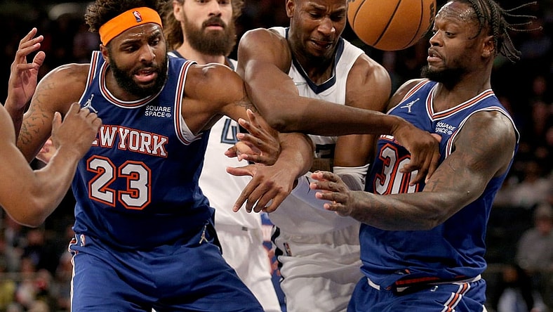 Feb 2, 2022; New York, New York, USA; Memphis Grizzlies forward Jaren Jackson Jr. (13) and center Steven Adams (4) fight for a rebound against New York Knicks center Mitchell Robinson (23) and forward Julius Randle (30) during the third quarter at Madison Square Garden. Mandatory Credit: Brad Penner-USA TODAY Sports