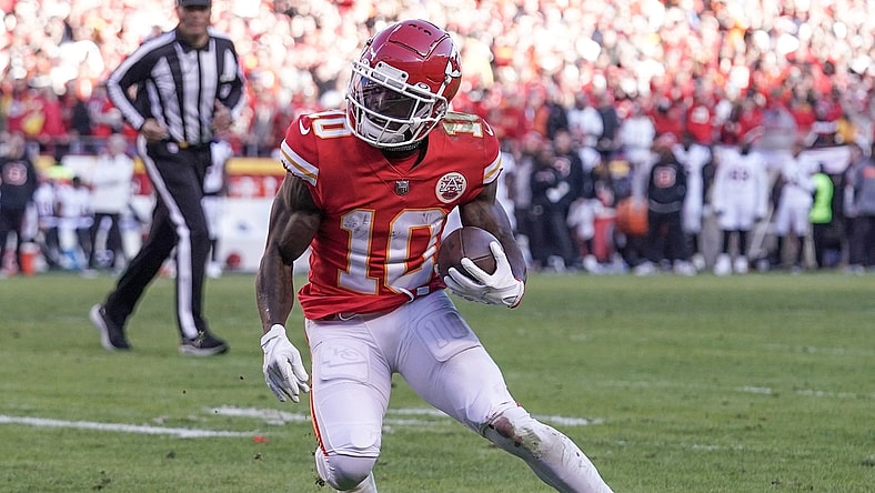 Jan 30, 2022; Kansas City, Missouri, USA; Kansas City Chiefs wide receiver Tyreek Hill (10) runs the ball against the Cincinnati Bengals during the AFC Championship game at GEHA Field at Arrowhead Stadium. Mandatory Credit: Denny Medley-USA TODAY Sports