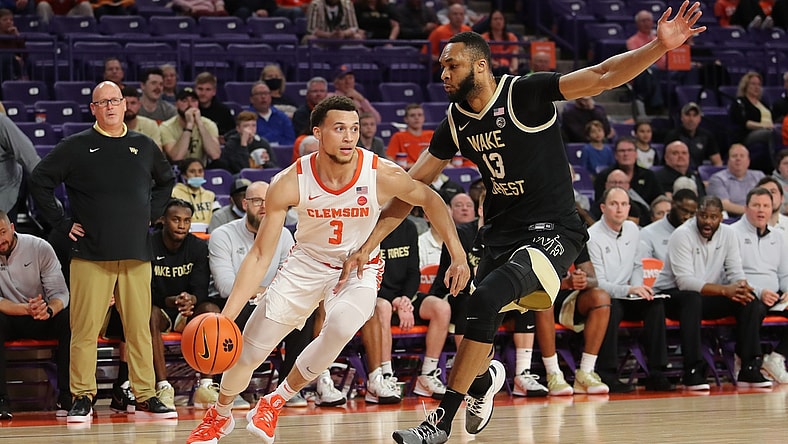 Feb 23, 2022; Clemson, South Carolina, USA; Clemson Tigers guard Chase Hunter (3) drives to the basket as Wake Forest Demon Deacons forward Dallas Walton (13) defends during the first half at Littlejohn Coliseum. Mandatory Credit: Dawson Powers-USA TODAY Sports