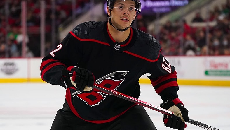 Feb 25, 2022; Raleigh, North Carolina, USA;  Carolina Hurricanes center Jesperi Kotkaniemi (82) watches the play against the Columbus Blue Jackets during the third period at PNC Arena. Mandatory Credit: James Guillory-USA TODAY Sports
