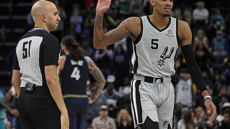 Feb 28, 2022; Memphis, Tennessee, USA; San Antonio Spurs guard Dejounte Murray (5) reacts after being ejected from the game against the Memphis Grizzles at FedExForum. Mandatory Credit: Petre Thomas-USA TODAY Sports