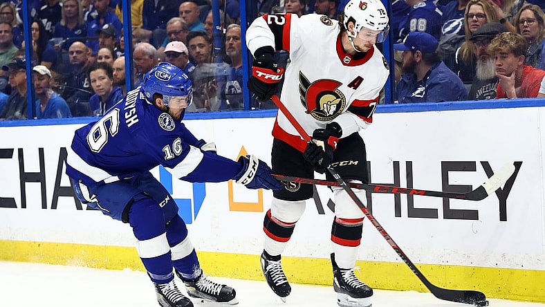 Mar 1, 2022; Tampa, Florida, USA; Ottawa Senators defenseman Thomas Chabot (72) skates with the puck as Tampa Bay Lightning right wing Taylor Raddysh (16) defends during the first period at Amalie Arena. Mandatory Credit: Kim Klement-USA TODAY Sports