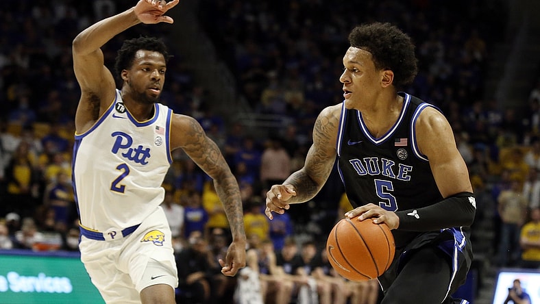 Mar 1, 2022; Pittsburgh, Pennsylvania, USA;  Duke Blue Devils forward Paolo Banchero (5) drives to the basket against Pittsburgh Panthers guard Femi Odukale (2) during the first half at the Petersen Events Center. Mandatory Credit: Charles LeClaire-USA TODAY Sports