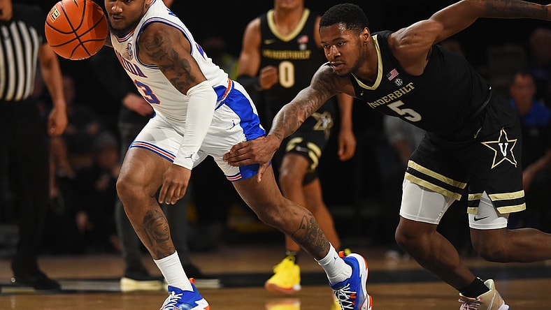 Mar 1, 2022; Nashville, Tennessee, USA; Florida Gators guard Brandon McKissic (23) runs with the ball after stealing it from Vanderbilt Commodores guard Shane Dezonie (5) during the first half at Memorial Gymnasium. Mandatory Credit: Christopher Hanewinckel-USA TODAY Sports