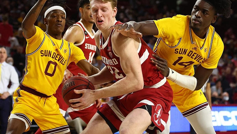 Mar 5, 2022; Tempe, Arizona, USA; Stanford Cardinal forward James Keefe (22) drives to the basket against Arizona State Sun Devils center Enoch Boakye (14) and guard DJ Horne (0) in the first half at Desert Financial Arena. Mandatory Credit: Mark J. Rebilas-USA TODAY Sports