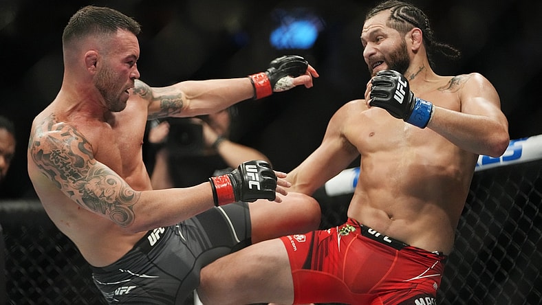 Mar 5, 2022; Las Vegas, Nevada, UNITED STATES; Colby Covington (red gloves) fights Jorge Masvidal (blue gloves) during UFC 272 at T-Mobile Arena. Mandatory Credit: Stephen R. Sylvanie-USA TODAY Sports
