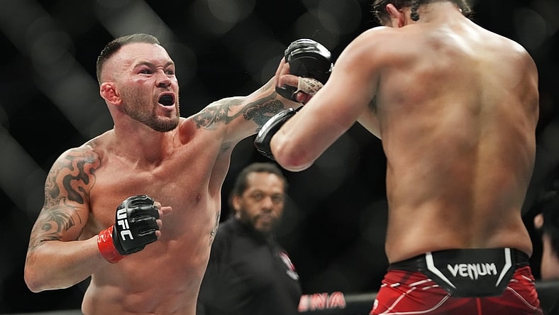 Mar 5, 2022; Las Vegas, Nevada, UNITED STATES; Colby Covington (red gloves) fights Jorge Masvidal (blue gloves) during UFC 272 at T-Mobile Arena. Mandatory Credit: Stephen R. Sylvanie-USA TODAY Sports