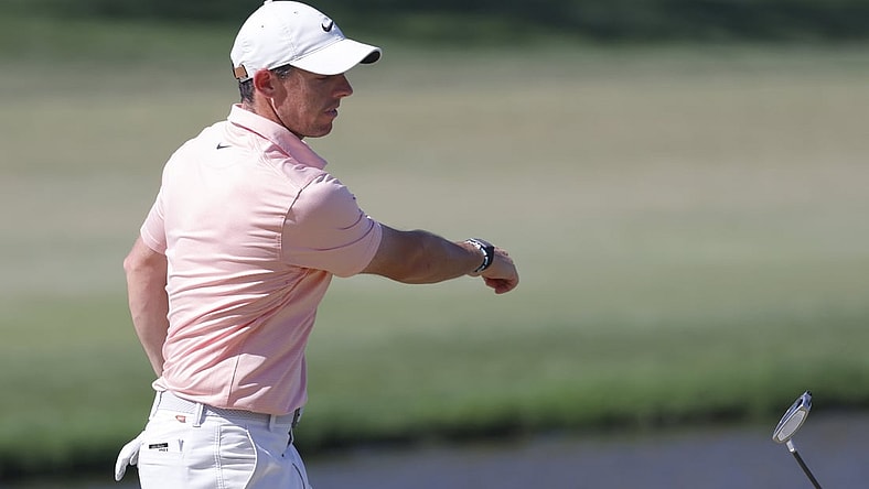 Mar 6, 2022; Orlando, Florida, USA; Rory McIlroy throws his putter toward the lake after missing a putt on the eighth green during the final round of the Arnold Palmer Invitational golf tournament. Mandatory Credit: Reinhold Matay-USA TODAY Sports