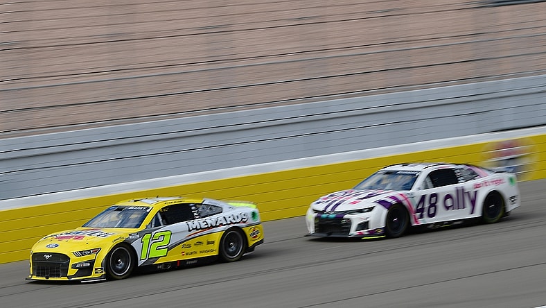 Mar 6, 2022; Las Vegas, Nevada, USA; NASCAR Cup Series driver Ryan Blaney (12) drives ahead of driver Alex Bowman (48) during the Pennzoil 400 at Las Vegas Motor Speedway. Mandatory Credit: Gary A. Vasquez-USA TODAY Sports