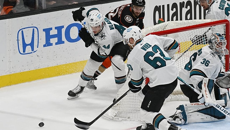 Mar 6, 2022; Anaheim, California, USA; San Jose Sharks defenseman Marc-Edouard Vlasic (44) and left wing Jeffrey Viel (63) skate after the puck against Anaheim Ducks defenseman Kevin Shattenkirk (22) in the second period at Honda Center. Mandatory Credit: Richard Mackson-USA TODAY Sports